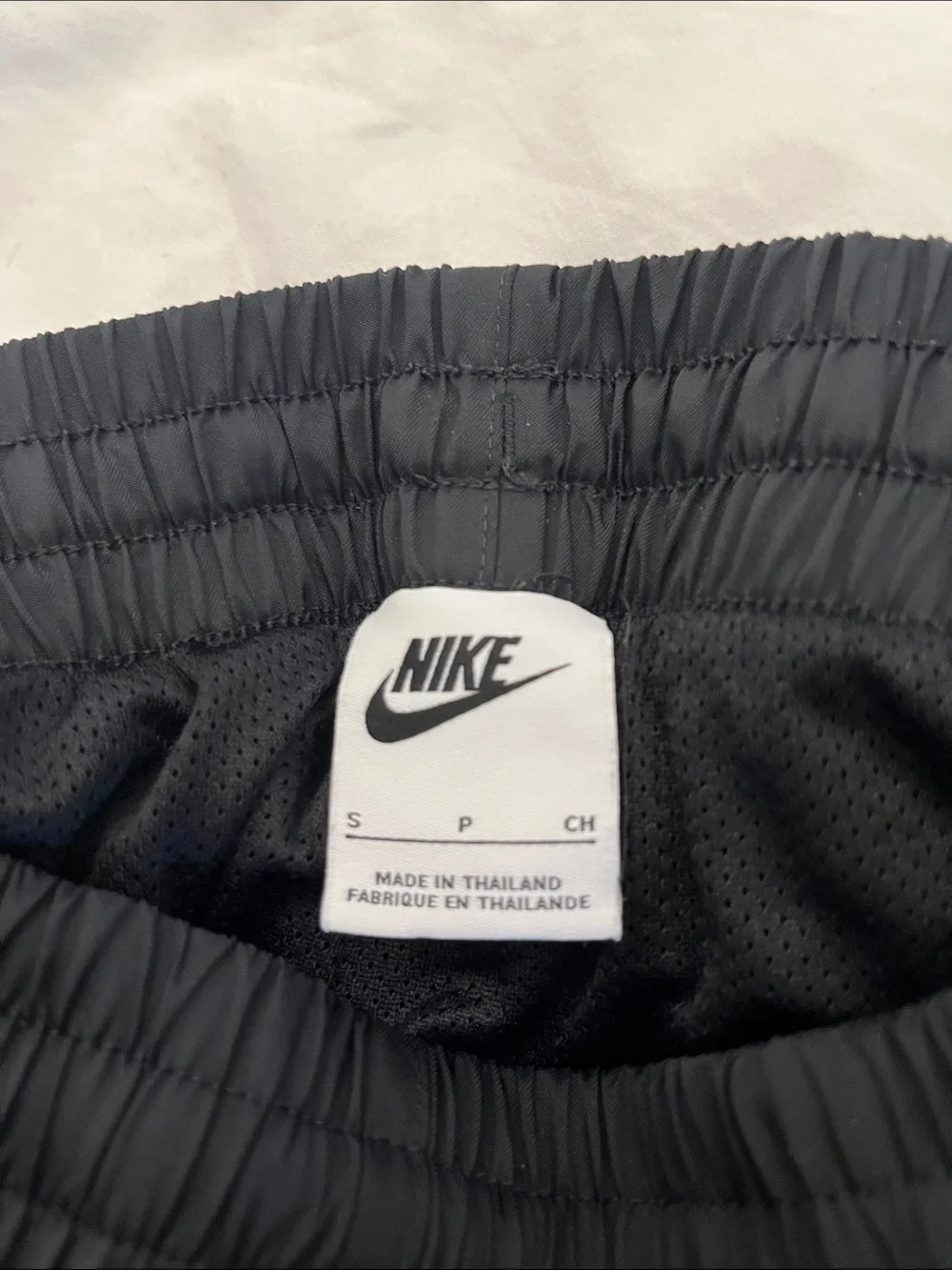 Nike kids Black Athletic Shorts with White Swoosh